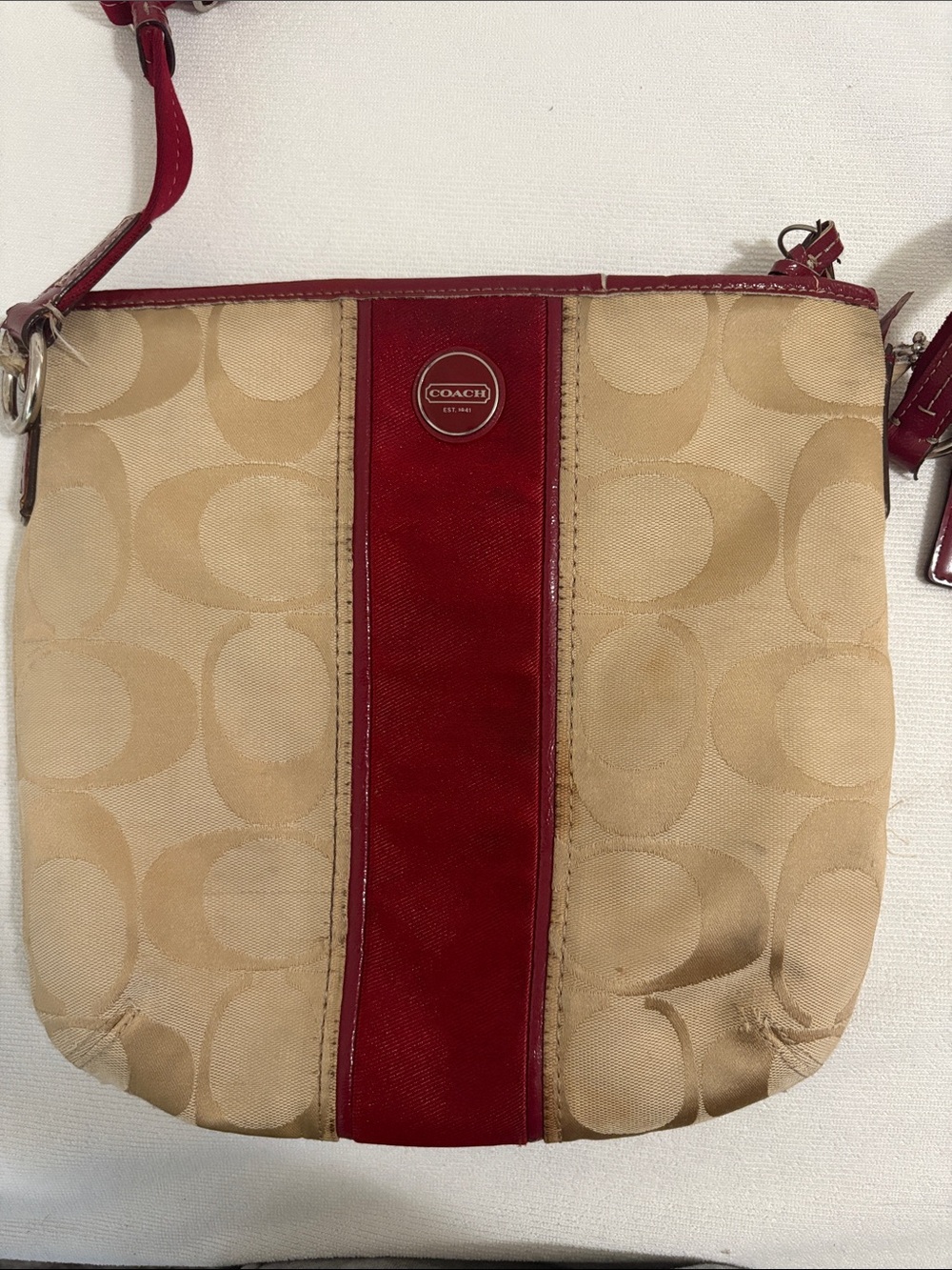 Coach signature C jacquard canvas crossbody bag with burgundy trim